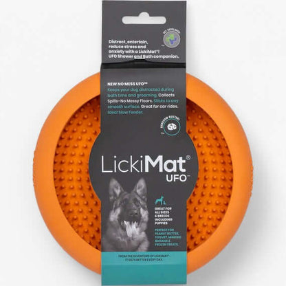 LickiMat UFO orange slow feeder for dogs, designed to reduce stress during grooming with suction cups.