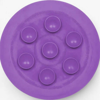 LickiMat UFO purple slow feeder bowl with suction cups for enriching pet mealtime.