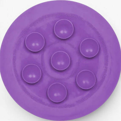LickiMat UFO purple slow feeder bowl with suction cups for enriching pet mealtime.